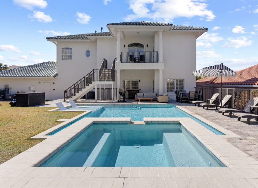 View of a private pool and hot tub